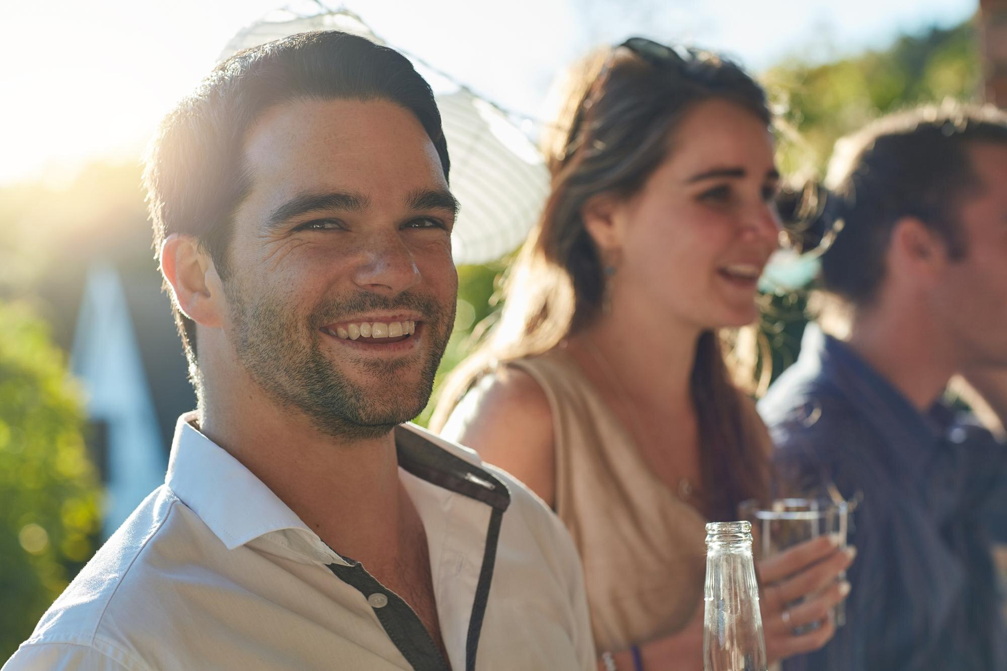 friends party man portrait backyard drink with beer bottle celebration vacation people excited socia