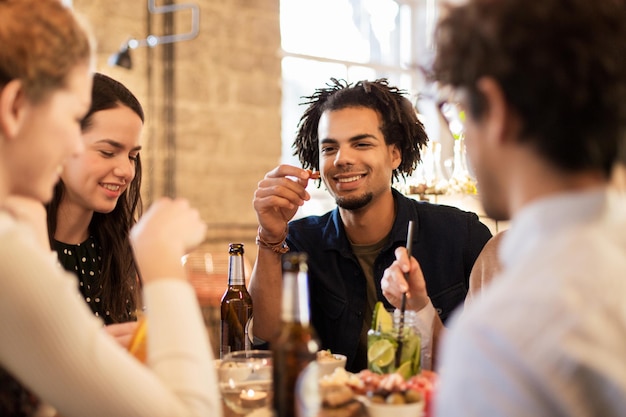 leisure food drinks people holidays concept happy friends eating drinking bar cafe 380164 169969